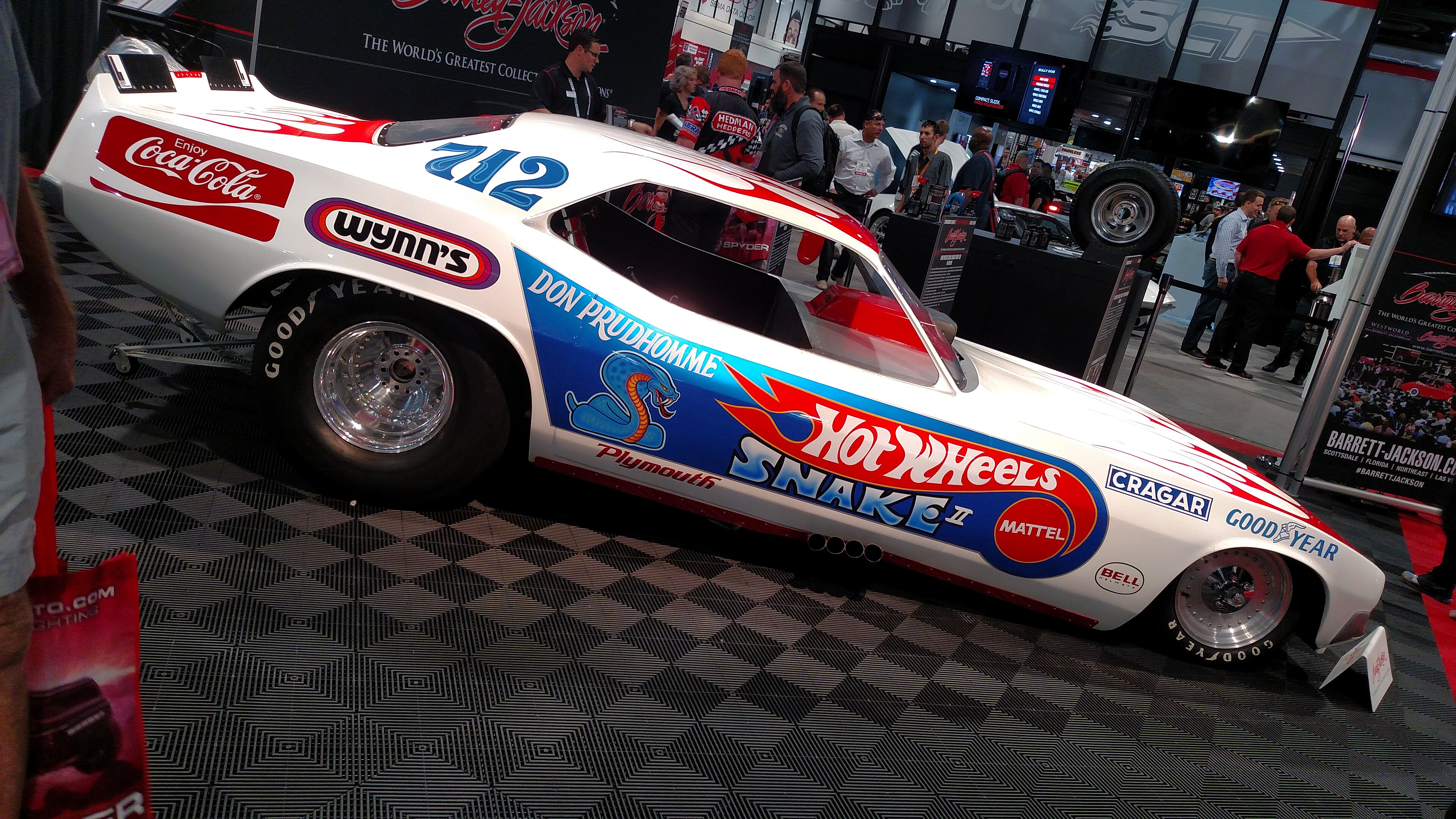 Don Prudhomme’s Snake II Funny Car on display at SEMA in November 2016. Historical event photograph, not the 2026 show. Photo: _salguod, via Wikimedia Commons. License: https://creativecommons.org/licenses/by-sa/2.0/ Wikimedia resized derivative, otherwise unaltered; image remains under this license. Source: https://commons.wikimedia.org/wiki/File:Don_Prudhomme_Snake_Hot_Wheels_Funny_Car.jpg
