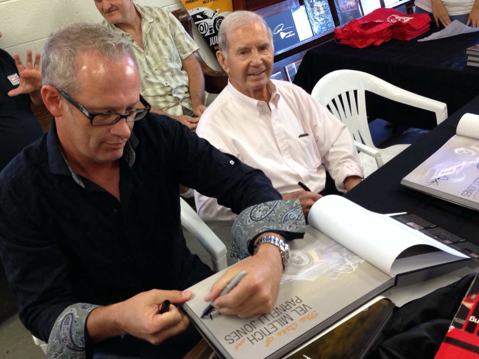 Dean Kirkland and Parnelli Jones at a book signing at Autobooks-Aerobooks. Courtesy of Dean Kirkland.